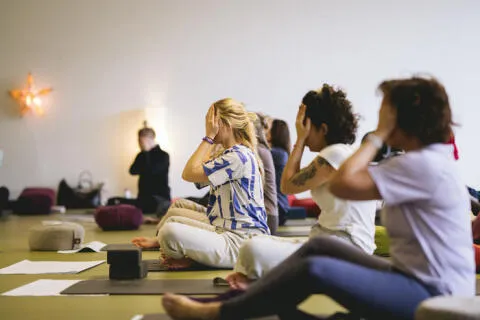 a group of students practicing yoga